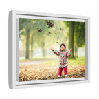 Framed Matte Canvas Photo Print — Autumn Child Playing in Leaves